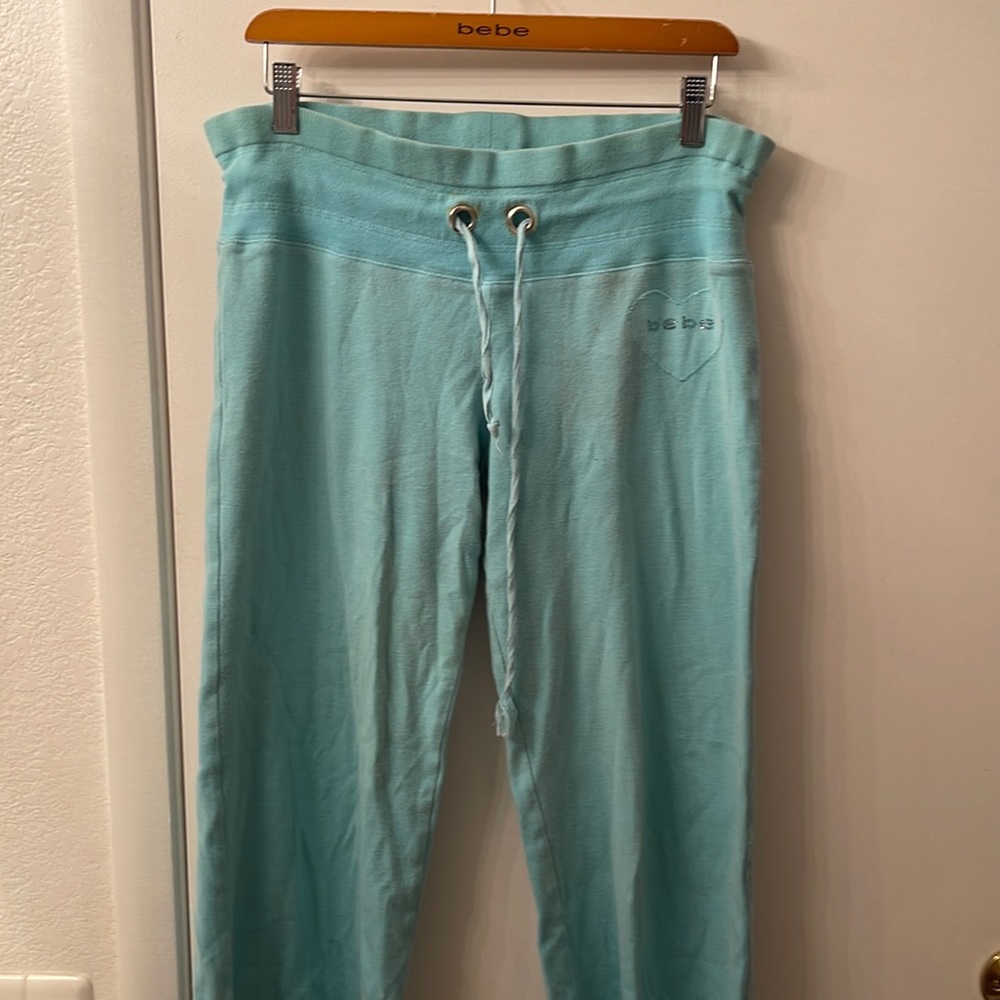 bebe teal colored 3/4 pants size Large